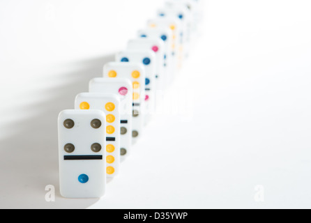 Line of colourful dominoes on white background Stock Photo