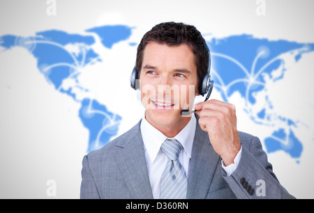 Smiling businessman using headset Stock Photo