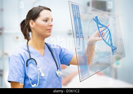 Nurse touching screen displaying blue DNA helix Stock Photo