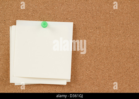 four empty note papers on cork board Stock Photo