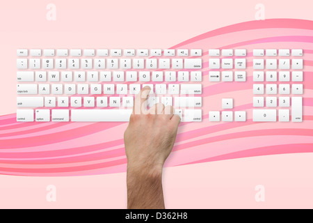 Hand pressing the l key on keyboard Stock Photo