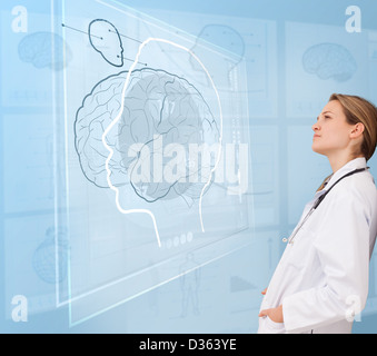Woman doctor using a futuristic interface Stock Photo