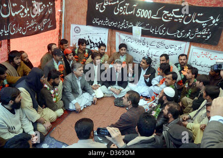 Deputy Commissioner Quetta, Abdul Mansoor Kakar  dialogues with teachers who are sit-in in favor of their demands at Haqooq Teachers Association  protest camps near Quetta press club on Monday, February 11, 2013. Balochistan Package  teachers were on hunger strike for last 10 days. Stock Photo