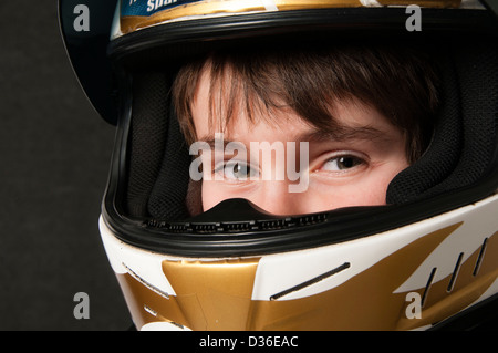 Child Wearing A Motorsport Crash Helmet Stock Photo