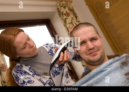 26 year old man in process of having all his hair shaved off for a cancer charity, Bordon, Hampshire, UK. Stock Photo