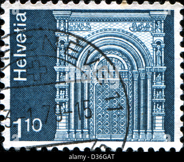 SWITZERLAND - CIRCA 1973: A stamp printed in Switzerland shows Gallus Portal, Basel Cathedral, circa 1973  Stock Photo
