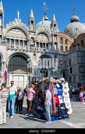 Stall Selling Tourist Souvenirs in front of Basilica of St Mark St. Mark's Square Venice Stock Photo