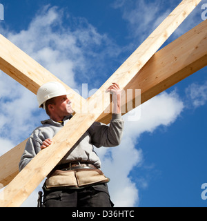 real builder at work on construction site. making a roof Stock Photo