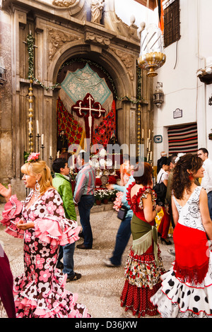 Women in traditional dress during Day of the Cross festival at the Convent of the Comendadoras de Santiago in Granada, Spain Stock Photo