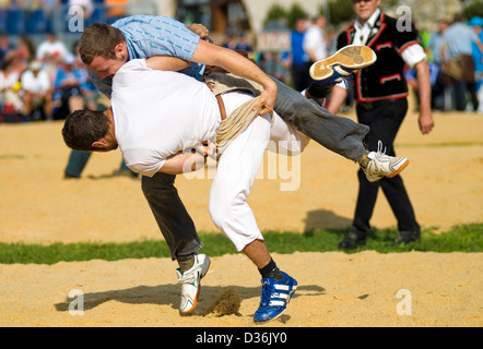 Schwingen (Swiss wrestling) at folklore festival, with spectators in background Stock Photo