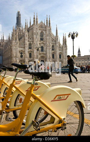 Milan Cathedral and Bike Mi bikes Milan's bicycle rental system Piazza Duomo Milan Lombardy Italy Europe Stock Photo