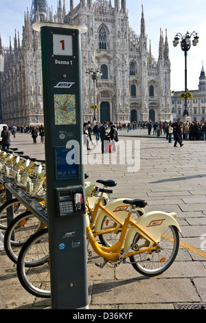 Milan Cathedral and a hire point docking station for Milan's Bike Mi rental bikes Piazza del Duomo Milan Lombardy Italy Europe Stock Photo
