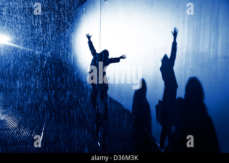 shadow of silhouette woman in the rain with arms open and outstretched ...