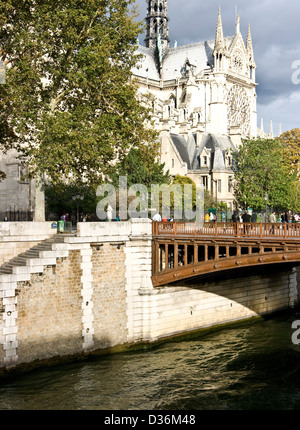 Pont au Double river Seine Notre Dame Cathedral at dusk Paris France Europe Stock Photo