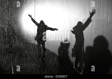 shadow of silhouette woman in the rain with arms open and outstretched ...