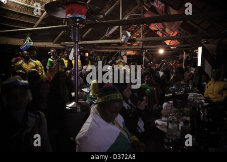 Bafana Bafana fans preparing to watch South Africa's Group A clash with Uruguay in a bar in Soweto. Stock Photo