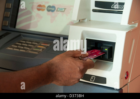 Inserting card in ATM machine Stock Photo