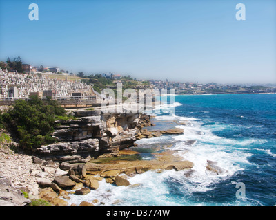 A portion of the Bondi to Coogee Walk with sea and waves on a sunny day. Stock Photo