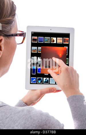Person is using a tablet computer. Photo library. Stock Photo