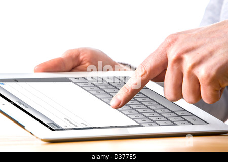 Person is using a tablet computer. Writing an e-mail. Stock Photo