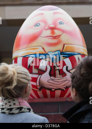 London, UK. 12th February 2013.  Veronica Fulton, 21, and Imogen Money, 22, from London admire the eggs. Over 100 giant Easter eggs designed by artists and designers were unveiled today in Covent Garden Piazza, London, to launch The Lindt Big Egg Hunt in support for the charity 'Action for Children'. For six weeks, from 12 February to 1 April 2013, giant Easter eggs will tour the country, from London's Covent Garden to Birmingham, Liverpool, Manchester, Glasgow and back to London in time for Easter. Photo: Nick Savage/Alamy Live News Stock Photo