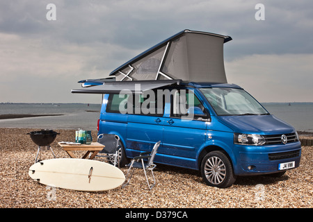 Blue metallic VW California campervan with optional awning on Southampton beach, UK, 07 05 2010 Stock Photo