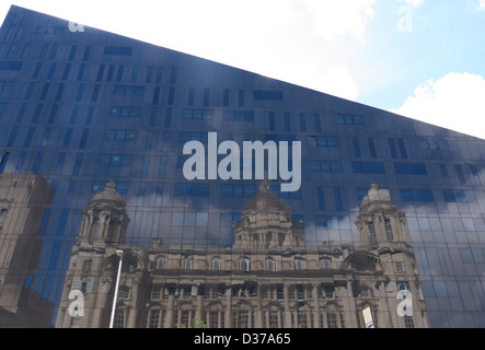 Apartments, designed by Broadwaymalyan. Reflected in the glass is the Port of Liverpool building Stock Photo