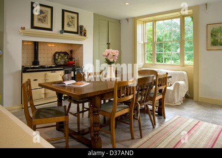 A traditional farmhouse style kitchen with Aga cooker.. Stock Photo