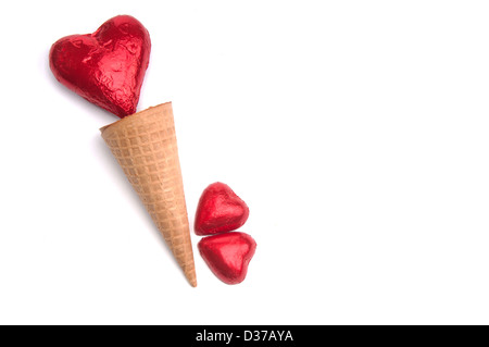 Red heart in a ice cream cone with two small red hearts Stock Photo
