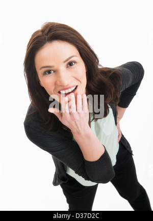 Studio portrait of mid adult woman Stock Photo