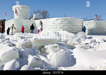 Children and families explore the ice palace at Saranac Lake Winter Carnival, Adirondacks, New York State Stock Photo