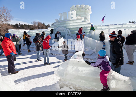 Children and families explore the ice palace at Saranac Lake Winter Carnival, Adirondacks, New York State Stock Photo