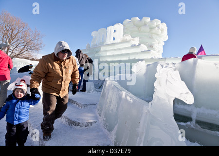 Children and families explore the ice palace at Saranac Lake Winter Carnival, Adirondacks, New York State Stock Photo