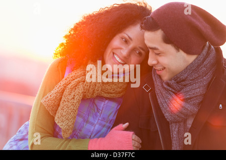 USA, New Jersey, Jersey City, Portrait of happy couple embracing at sunset Stock Photo
