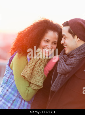 USA, New Jersey, Jersey City, Portrait of happy couple embracing at sunset Stock Photo