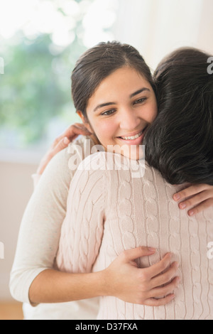 USA, New Jersey, Jersey City, Grandmother and granddaughter (16-17) embracing Stock Photo