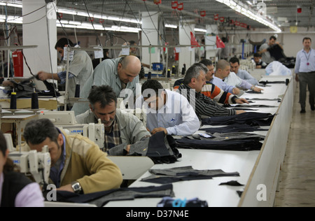 Istanbul, Turkey, people at sewing machines in a textile factory Stock Photo