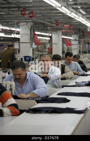 Istanbul, Turkey, people at sewing machines in a textile factory Stock Photo