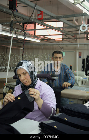 Istanbul, Turkey, people at sewing machines in a textile factory Stock Photo