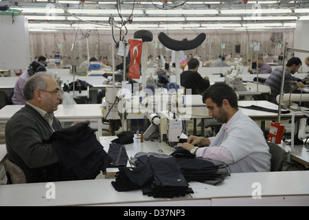 Istanbul, Turkey, people at sewing machines in a textile factory Stock Photo