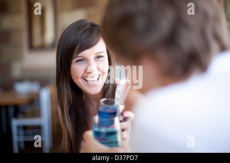 Couple toasting with cocktails Stock Photo