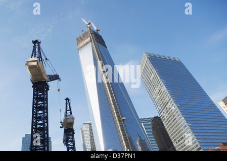 Low angle view of crane and skyscrapers Stock Photo