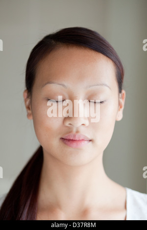 Close up of woman with eyes closed Stock Photo