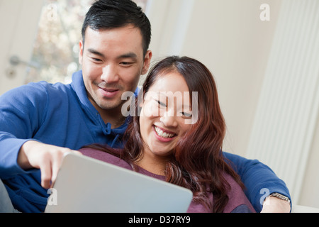 Couple using tablet computer together Stock Photo