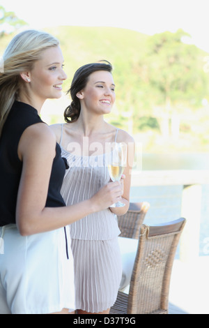 Women drinking wine together outdoors Stock Photo