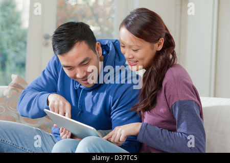 Couple using tablet computer together Stock Photo