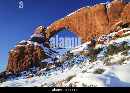 South Window Arch under snow, The Windows, Arches National Park, Moab, Utah USA Stock Photo