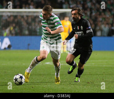 Glasgow, Scotland, UK. 12th February 2013.   Andrea Pirlo chases James Forrest during the Champions League game between Celtic and Juventus from Celtic Park. Credit: Action Plus Sports Images / Alamy Live News Stock Photo