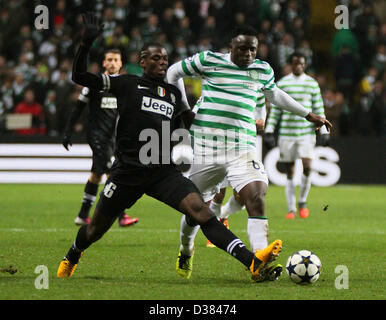 Glasgow, Scotland, UK. 12th February 2013.  Paul Pogba tackles Victor Wanyama during the Champions League game between Celtic and Juventus from Celtic Park. Credit: Action Plus Sports Images / Alamy Live News Stock Photo