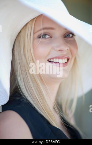 Smiling woman wearing hat Stock Photo